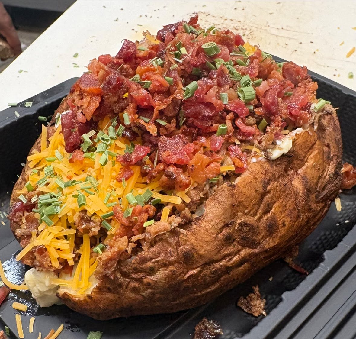 Cheddar broccoli loaded baked potato with bacon